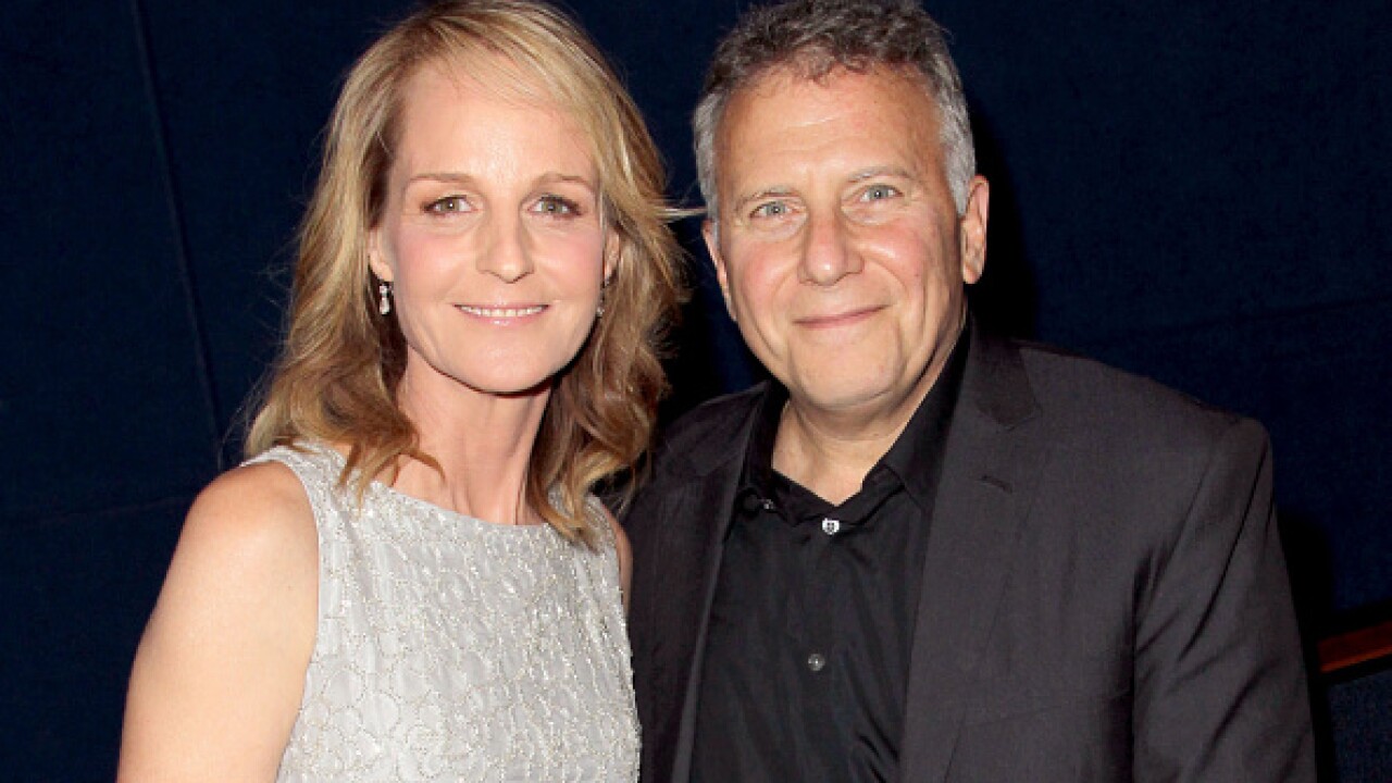Helen Hunt & Paul Reiser stands side by side, posing for the camera